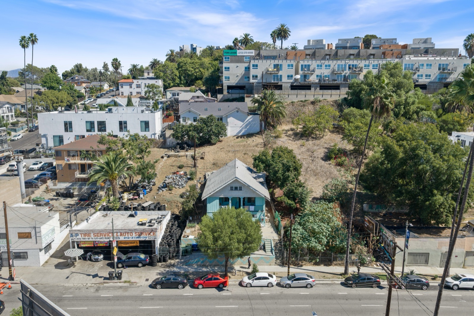 Aerial view of the 1283 W Sunset Boulevard parcel in Echo Park, a hillside lot fronting Sunset